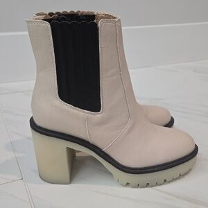 Elegant Beige Heeled Boots with Black Accents